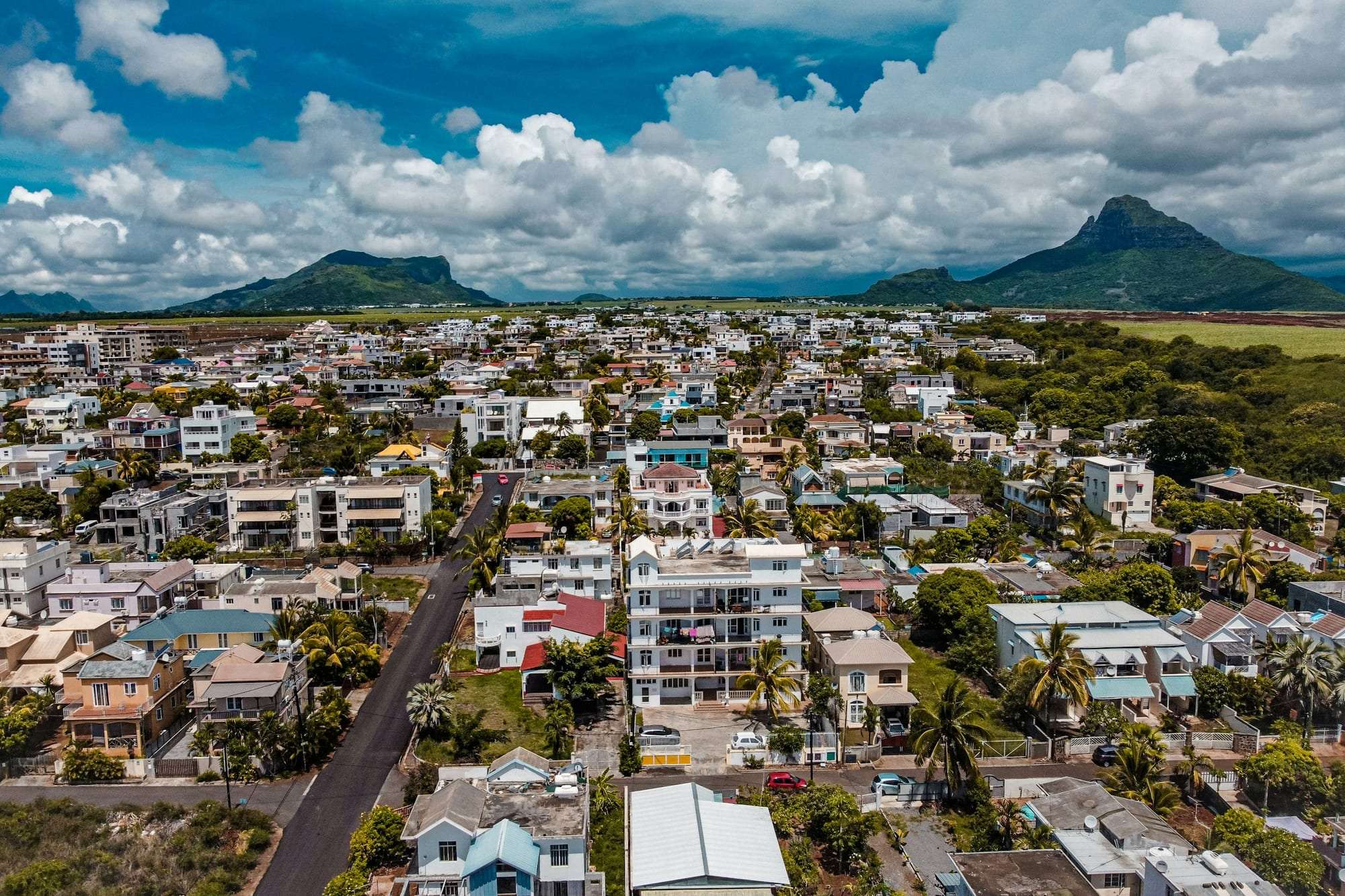 A residential town in Mauritius beneath green mountains
