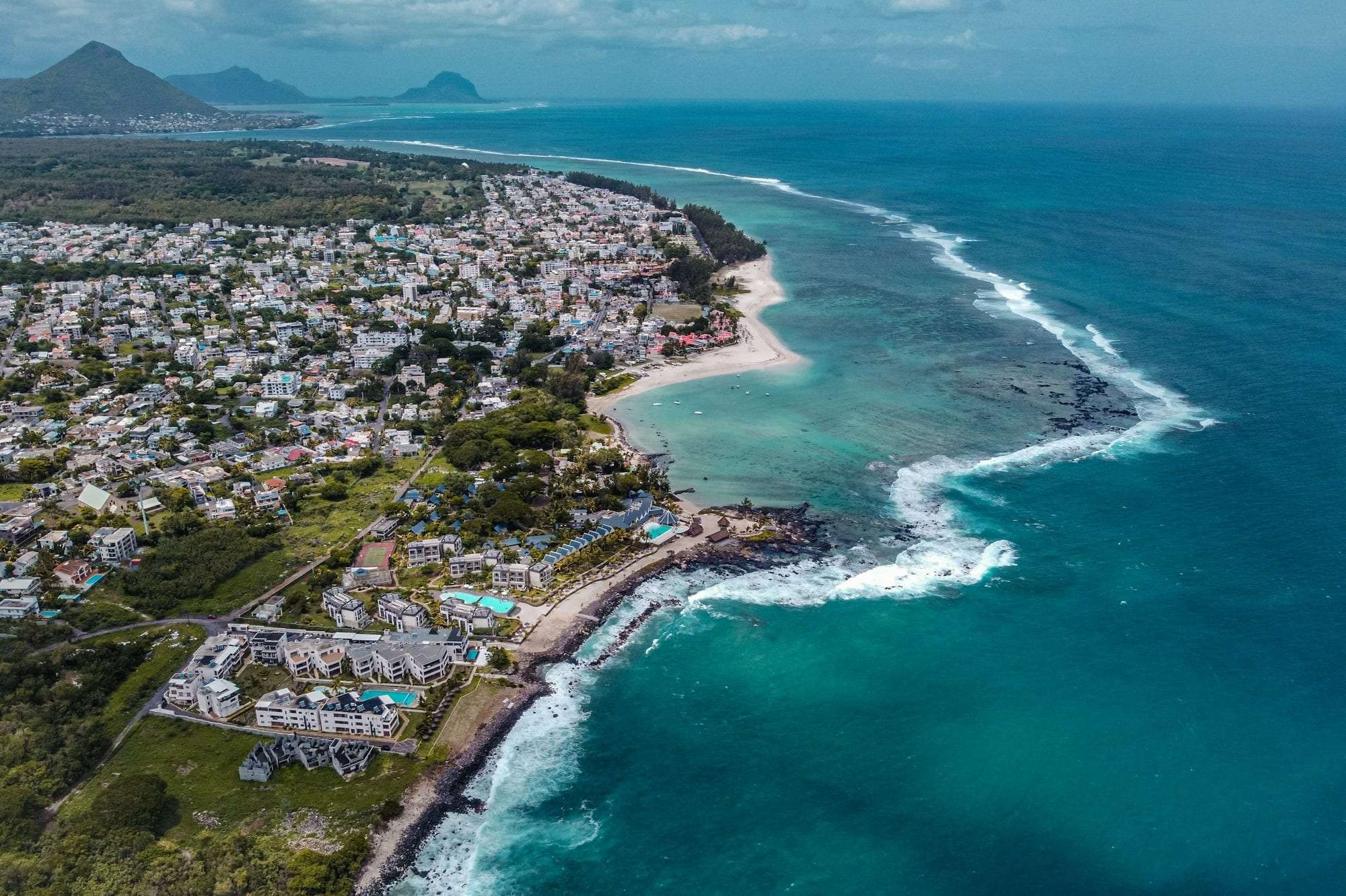 Aerial view of a coastal town and its roads in Mauritius