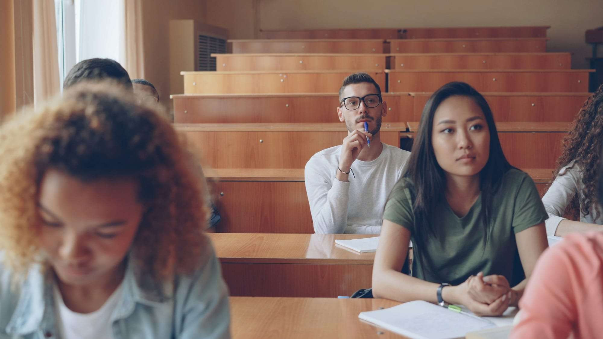 Students listening attentively in a lecture hall